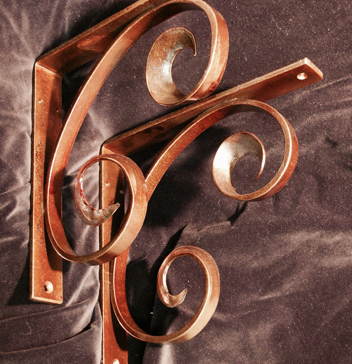 Pair of Counter bracket forged blow over scroll